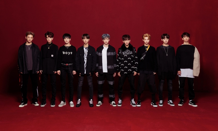 Stray Kids K-Pop Boy Band on Red Background