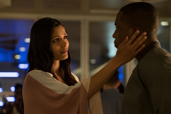 Freida Pinto touches Leslie Odom Jr.'s face in Needle In A Timestack