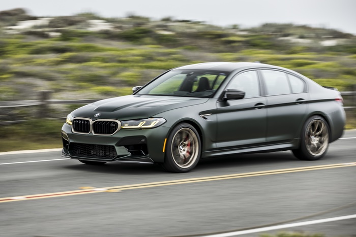 2022 Green BMW M5 CS driving on road