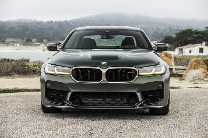 Green 2022 BMW M5 CS luxury car by the coast