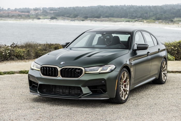 Green BMW M5 CS Luxury Car by the Ocean