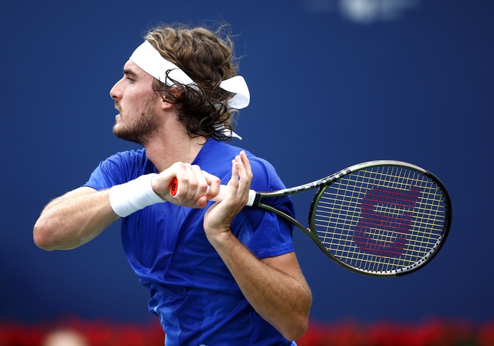 Stefanos Tsitsipas playing tennis