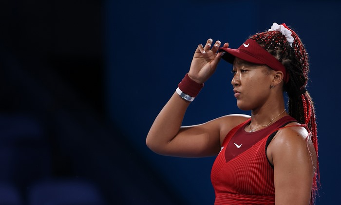 Naomi Osaka, Japanese tennis player, adjusts visor