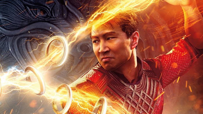 Simu Liu as Shang-Chi wielding glowing Ten Rings
