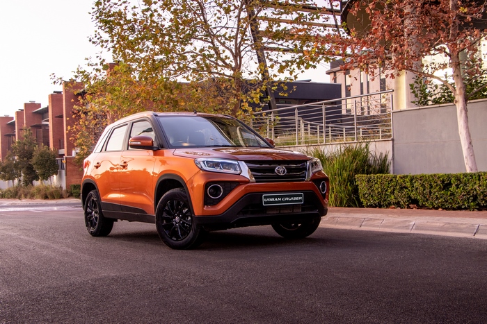 Orange Toyota Urban Cruiser SUV parked on street