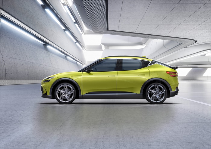 Genesis GV60 SUV in a modern concrete garage