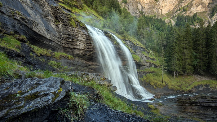 Cascading Waterfall in a Green Mountain Forest