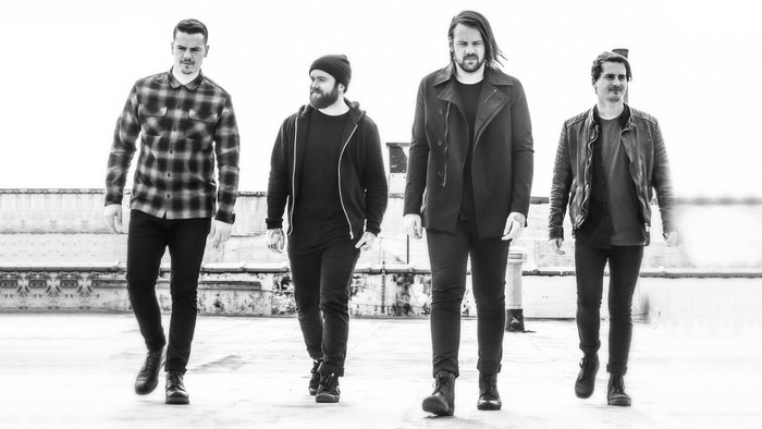 Beartooth band members walking in black and white