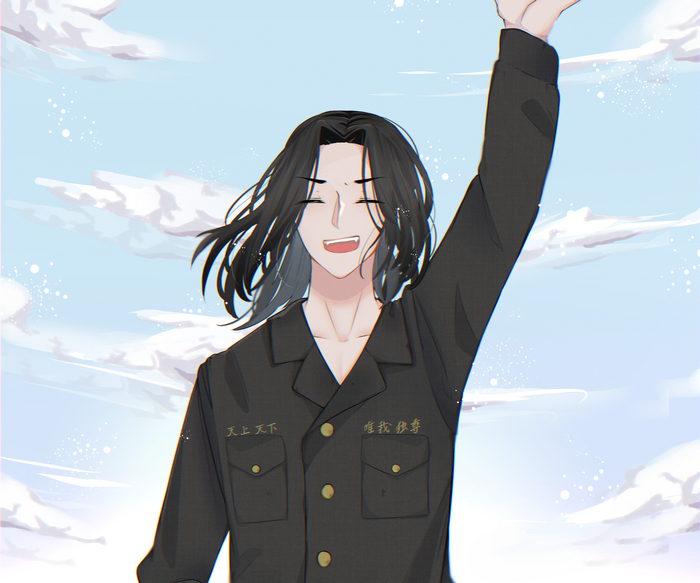 Happy Keisuke Baji with arm raised in sky
