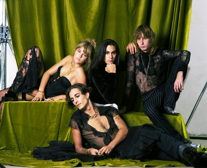Maneskin group portrait on green fabric