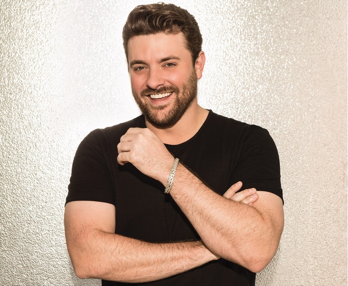 Chris Young smiling portrait with crossed arms