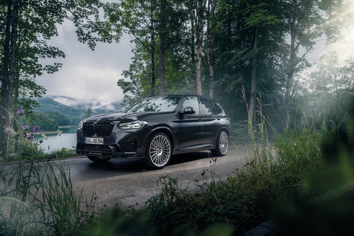 BMW Alpina XD3 SUV by a scenic mountain lake