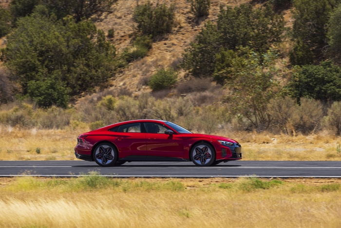 Red Audi RS e-tron GT electric sport car on road