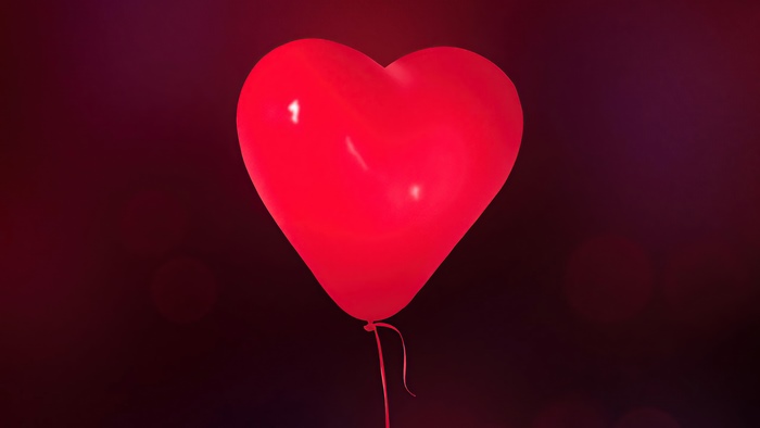 Artistic Red Heart Balloon with Dark Bokeh
