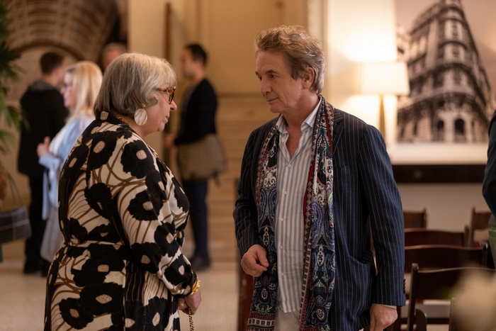 Martin Short talking to a woman in Only Murders in the Building