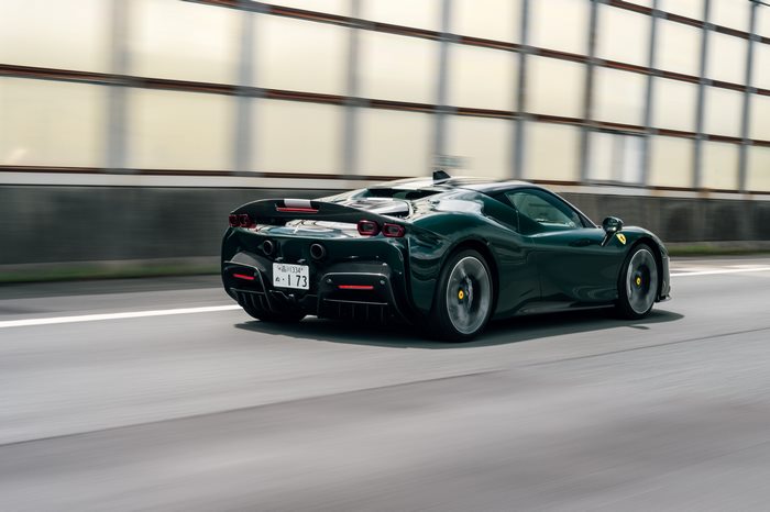 Green Ferrari SF90 Stradale on Road