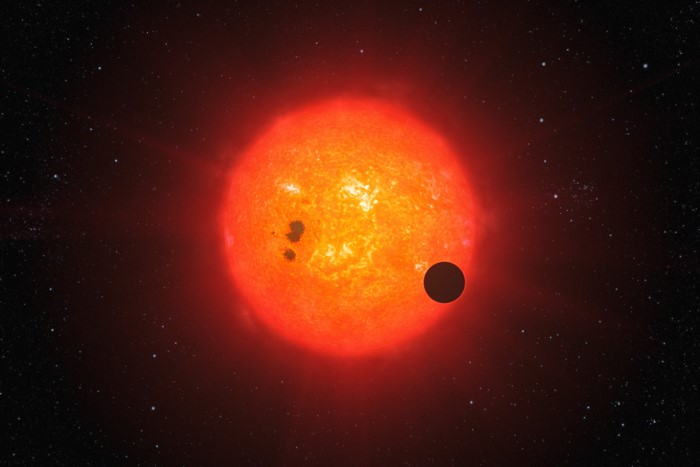 Artist's impression of exoplanet GJ1214b transiting its star