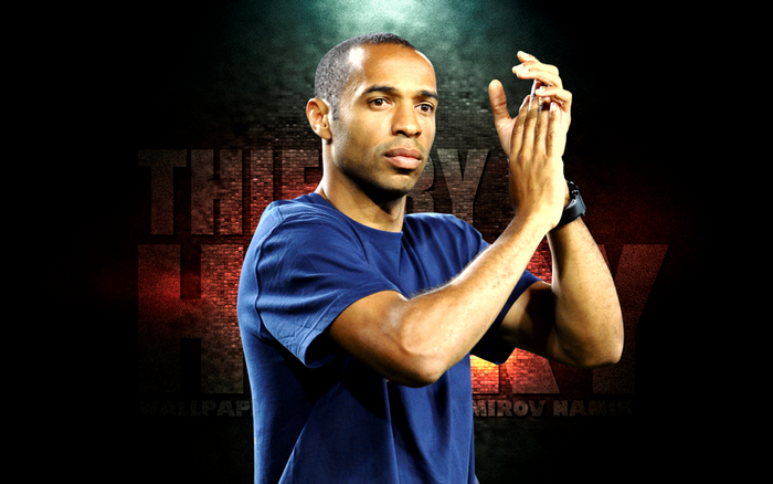 Thierry Henry clapping in blue t-shirt