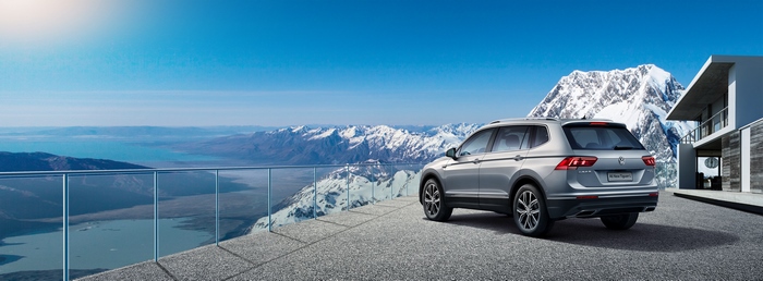 Volkswagen Tiguan L SUV with panoramic mountain and lake view