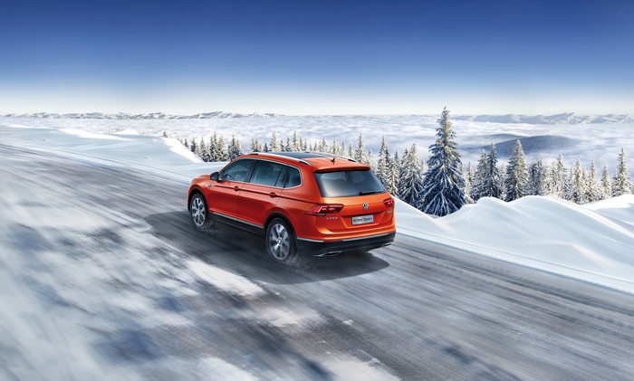 Volkswagen Tiguan L SUV on snowy mountain road