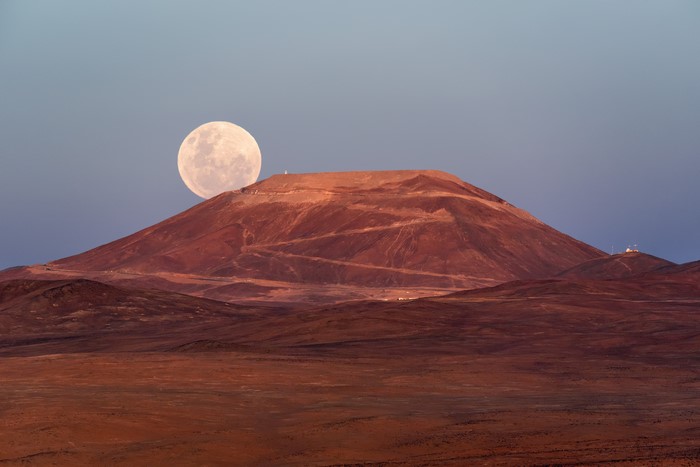 Supermoon rising over Cerro Armazones mountain in Chile