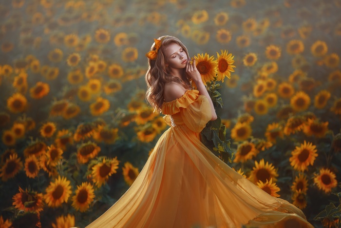 Model in Yellow Dress Among Sunflowers