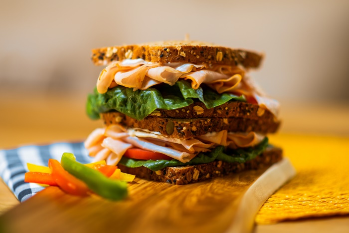 Stacked whole grain sandwich with veggies 4K