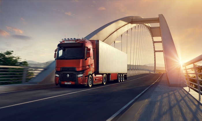 Renault Truck Crossing Modern Bridge at Sunset
