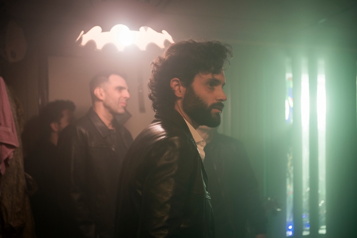 Penn Badgley in a hazy scene from The Birthday Cake