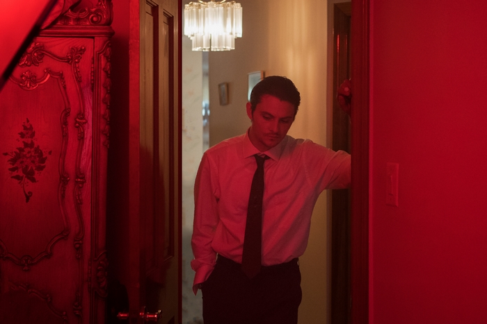 Shiloh Fernandez in red light from The Birthday Cake