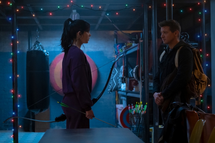 Hailee Steinfeld and Jeremy Renner in Dimly Lit Room