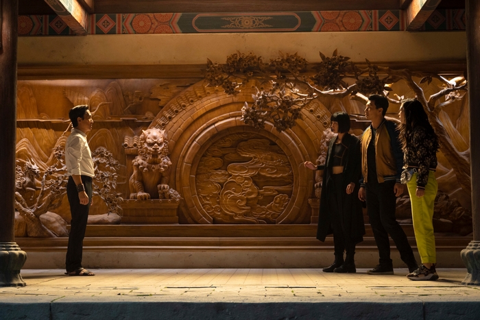 Shang-Chi characters in a richly carved room