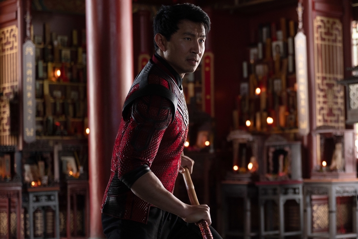 Shang-Chi holding a staff in a temple