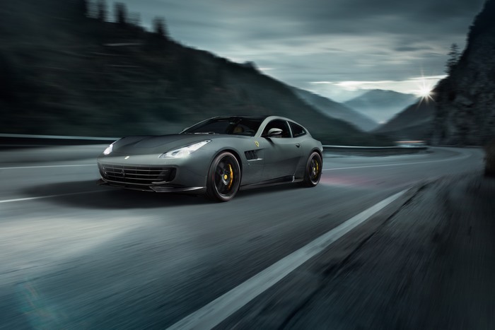 Novitec Rosso Ferrari GTC4Lusso speeding on a mountain road