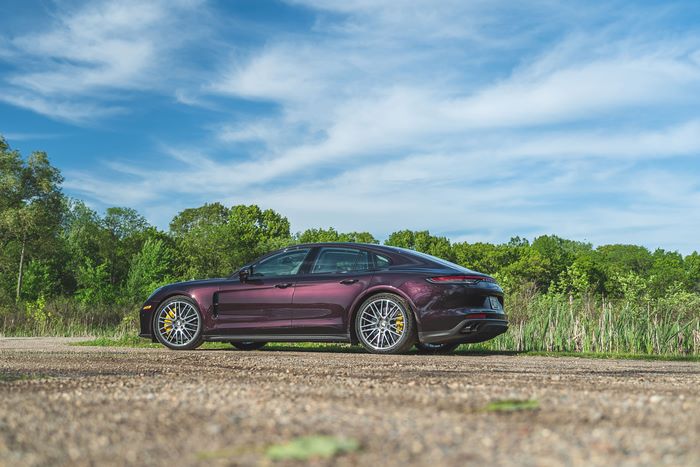 Purple Porsche Panamera Turbo S on a gravel road