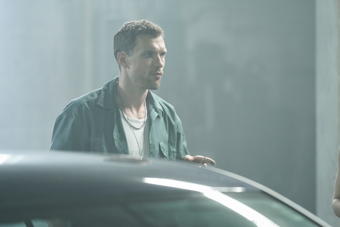 Ed Skrein looking intently in Naked Singularity