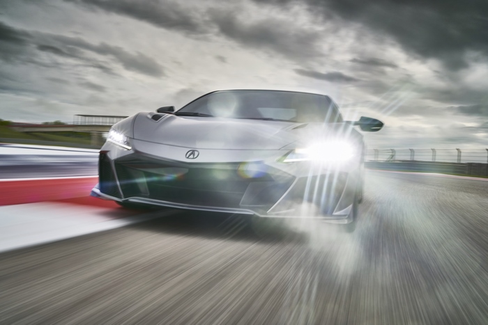 Acura NSX Type S supercar racing with bright headlights