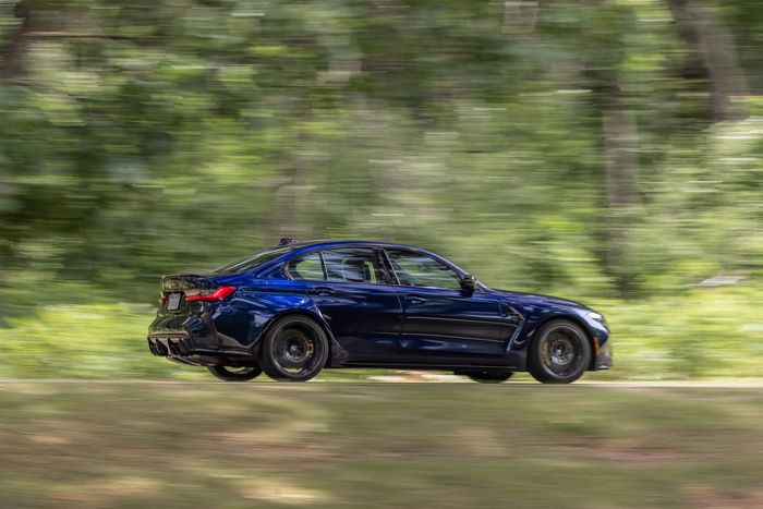 2021 Blue BMW M3 Competition in motion