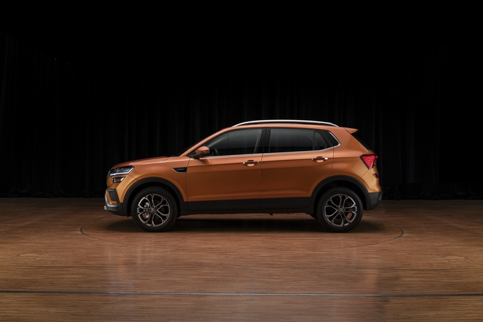 Orange Škoda Kushaq SUV side profile