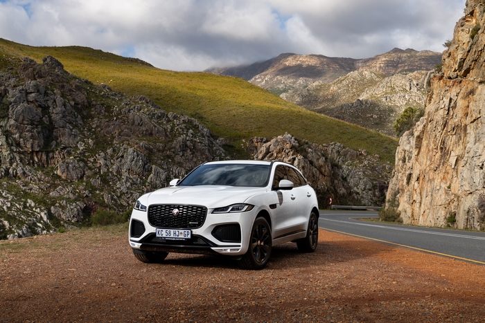 Luxury Jaguar F-Pace SUV on a scenic mountain road