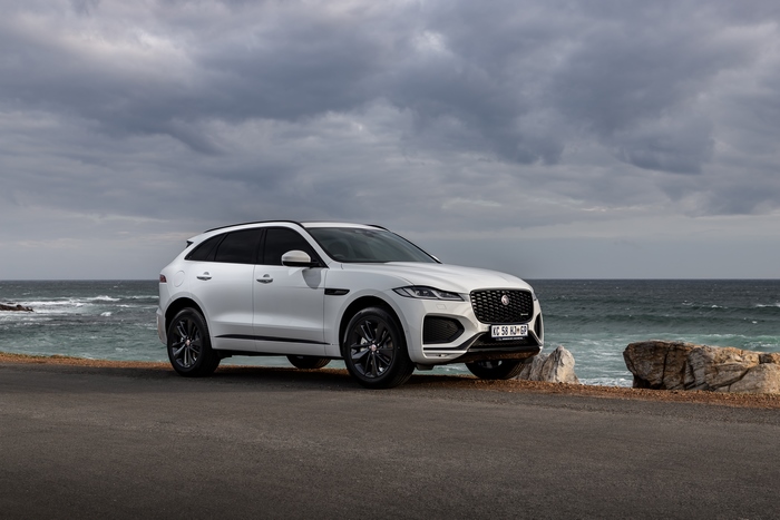 White Jaguar F-Pace SUV parked by the ocean