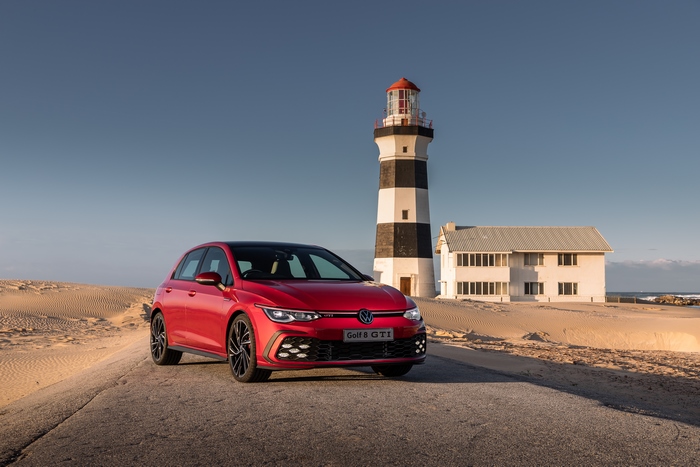 Volkswagen Golf GTI next to a lighthouse 4K