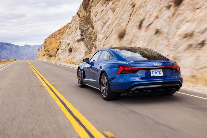 Blue Audi e-tron GT Quattro Driving on Mountain Road
