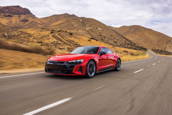 Red Audi RS e-tron GT electric sport car on desert road
