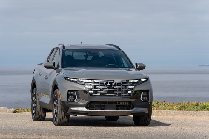 Grey Hyundai Santa Cruz pickup truck by the ocean