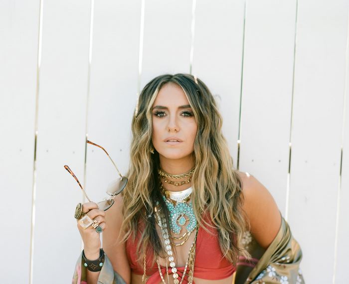 Lainey Wilson in bohemian style outdoor portrait