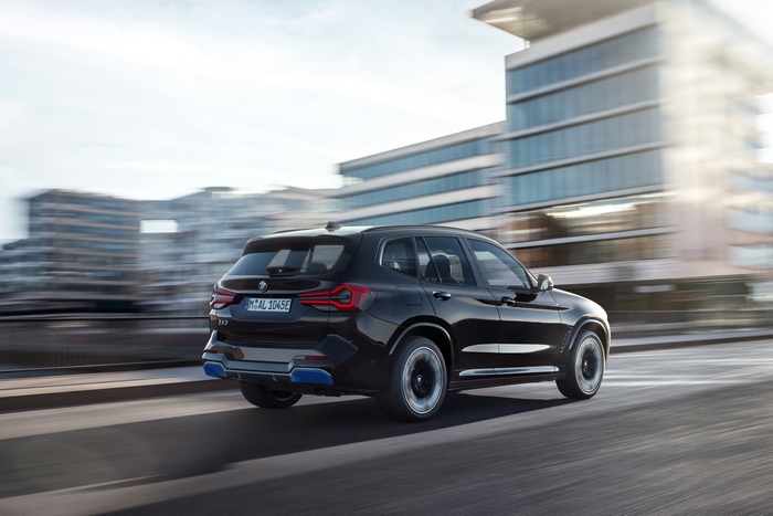 Black BMW iX3 M Sport electric SUV in motion