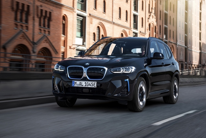 Black BMW iX3 M Sport electric SUV driving