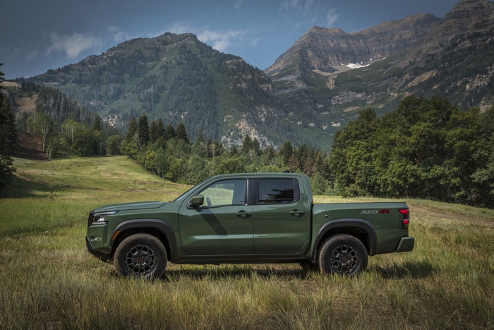 Green 2022 Nissan Frontier Pro-4X in mountain landscape