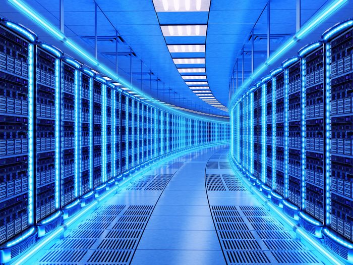 Futuristic Blue Lit Data Center Server Corridor